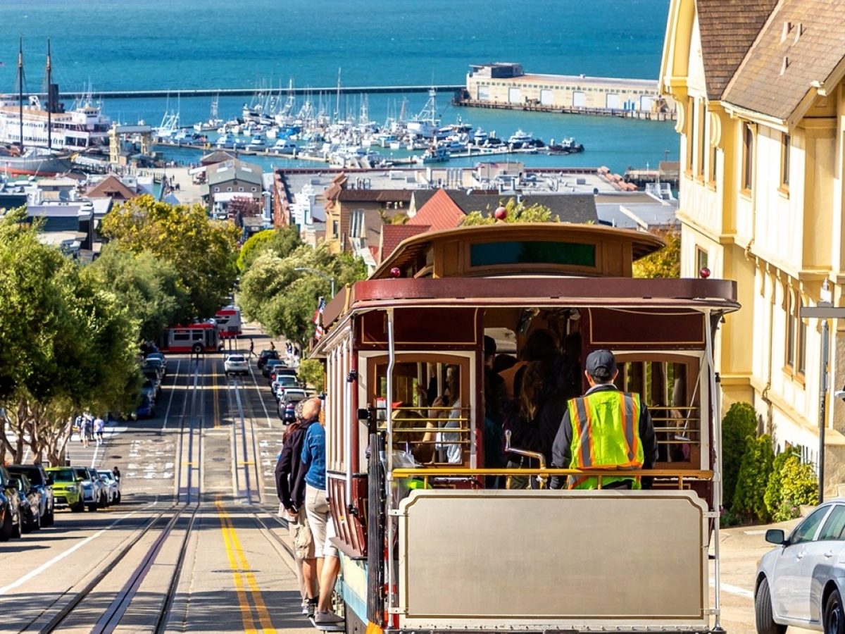 The Cable car tram and Alcatraz prison island on a background in San Francisco, California, USA